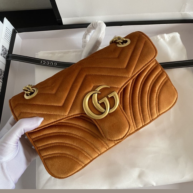 G*u*i clutch bags